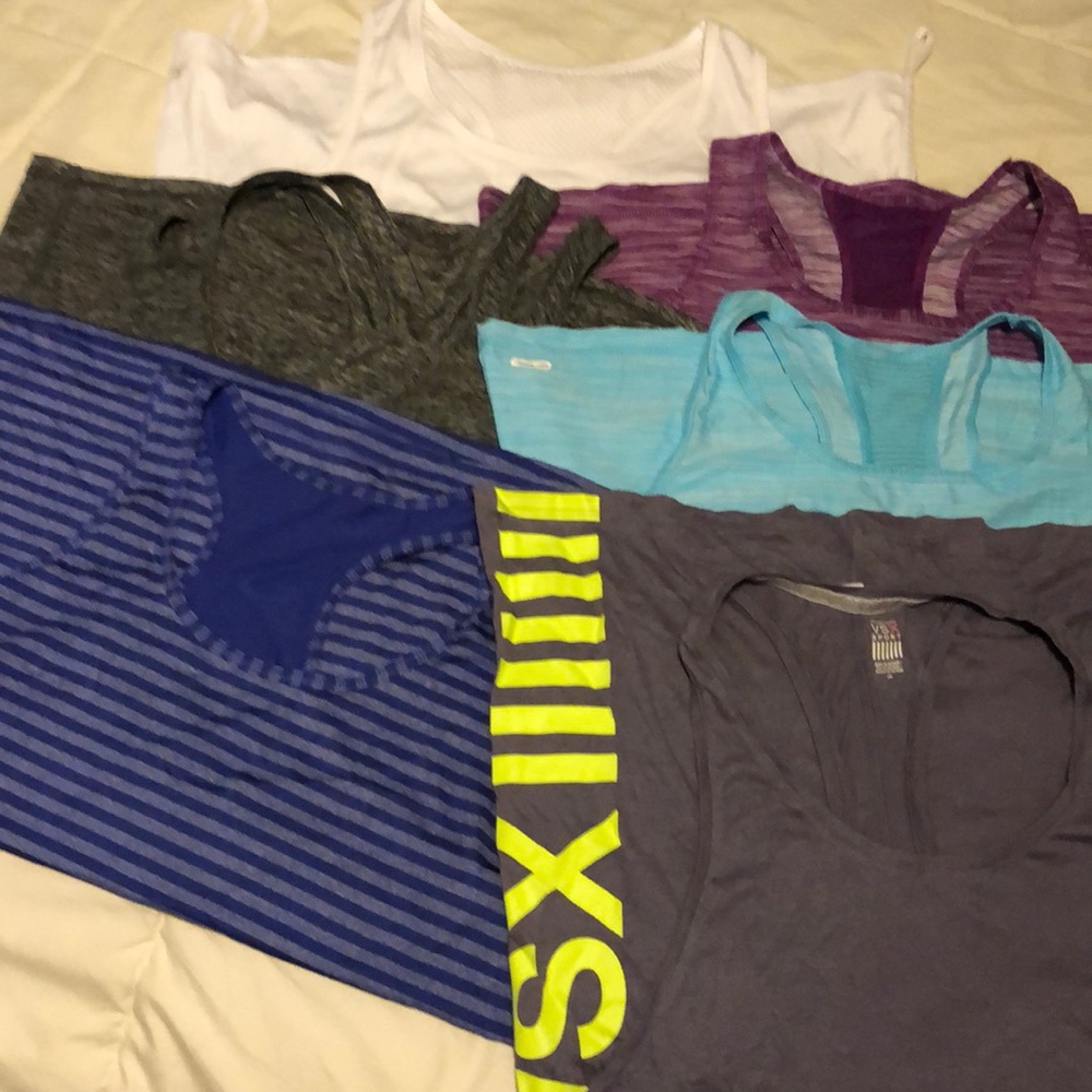 Six work out tops lightly if ever worn.